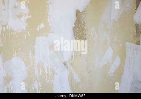 old grunge wall background with flaking and spackled light and dark sections Stock Photo