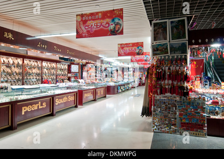 Souvenirs shop in undergrounds of Bund Sightseeing Tunnel in Shanghai, China Stock Photo