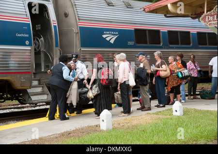 Amtrak passenger train and passengers at DeLand Station Florida USA Stock Photo