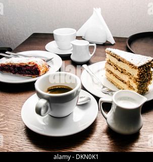 Two cups of coffee, milk, cake and dessert Stock Photo