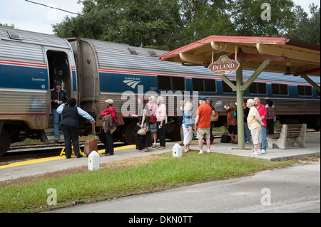Amtrak passenger train and passengers at DeLand Station Florida USA Stock Photo