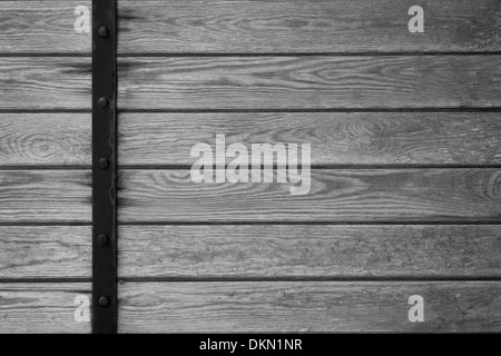 wooden planks background with black metal bar on left side or grey wood grain texture Stock Photo