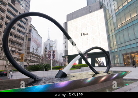 Fountain in front of Plaza 66 commercial and office complex at West Nanjing Road - famous shopping street in Shanghai, China Stock Photo