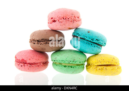 Colorful stacked French macaroons isolated over white background Stock Photo