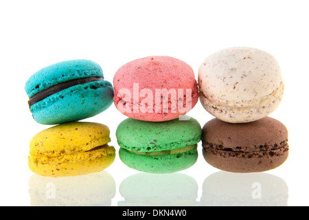 Colorful stacked French macaroons isolated over white background Stock Photo