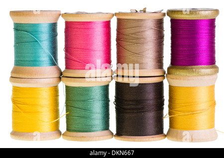 Eight spools of sewing thread isolated on white Stock Photo