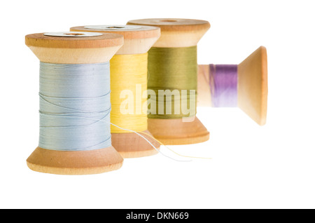 Four spools of sewing thread isolated on white Stock Photo
