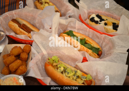 Hotdogs at fashionable London restaurant Bubbledogs that pairs hotdogs with champagne. Stock Photo