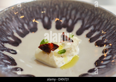 A dish of Burrata served at fashionable London restaurant Bubbledogs Stock Photo