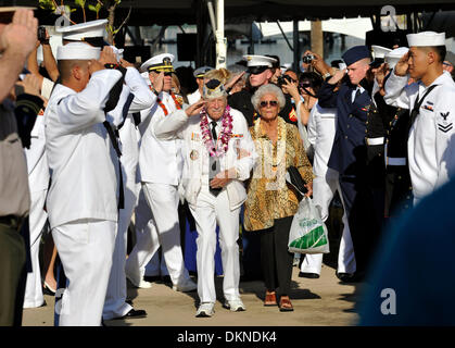 Pearl Harbor Survivor Wally Walling and Joan Bohl renders a salute during the 72nd Anniversary Pearl Harbor Day Commemoration ceremony December 7, 2013 in Honolulu, Hawaii. Stock Photo