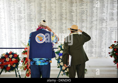 Pearl Harbor Survivor Pat Duncan and National Park Services historian Daniel Martinez render honors at the USS Arizona Memorial during the 72nd Anniversary Pearl Harbor Day Commemoration December 7, 2013 in Honolulu, Hawaii. Stock Photo