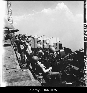 20mm gun crews standing by aboard the USS Hornet (CV-12) as her planes hit Tokyo, Japan. 520863 Stock Photo