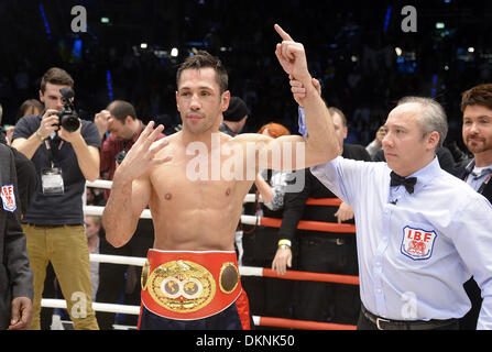 German boxer Felix Sturm cheers after winning the fight against  British IBF middleweight world champion Darren Barker in the middleweight world title bout at the Porsche Arena in Stuttgart, Germany, 7 December 2013. Sturm won the bout in the second round through technical knockout. Photo: Daniel Maurer/dpa Stock Photo