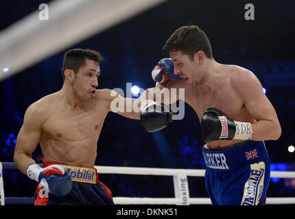 German boxer Felix Sturm (L) fights British IBF middleweight world champion Darren Barker in the middleweight world title bout at the Porsche Arena in Stuttgart, Germany, 7 December 2013. Sturm won the bout in the second round through technical knockout. Photo: Daniel Maurer/dpa Stock Photo