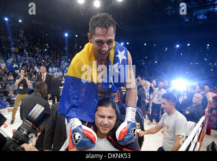 German boxer Felix Sturm cheers after winning the fight against  British IBF middleweight world champion Darren Barker in the middleweight world title bout at the Porsche Arena in Stuttgart, Germany, 7 December 2013. Sturm won the bout in the second round through technical knockout. Photo: Daniel Maurer/dpa Stock Photo