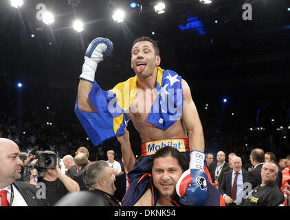 German boxer Felix Sturm cheers after winning the fight against  British IBF middleweight world champion Darren Barker in the middleweight world title bout at the Porsche Arena in Stuttgart, Germany, 7 December 2013. Sturm won the bout in the second round through technical knockout. Photo: Daniel Maurer/dpa Stock Photo