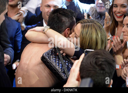 Stuttgart, Germany. 7th Dec, 2013. German boxer Felix Sturm (L) cheers and embraces his girlfriend Jasmin after winning the fight against British IBF middleweight world champion Darren Barker in the middleweight world title bout at the Porsche Arena in Stuttgart, Germany, 7 December 2013. Sturm won the bout in the second round through technical knockout. Photo: Daniel Maurer/dpa/Alamy Live News Stock Photo