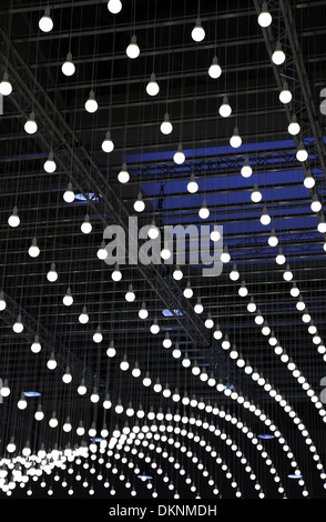 a lot of light bulbs hanging on the ceiling Stock Photo