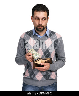 Upset man holding one dollar in hand and showing empty wallet to Stock Photo