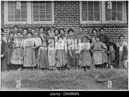 Payne Cotton Mill. Girl with drooping eyes and hands on hips has been helping one year. Macon, Ga. 523156 Stock Photo