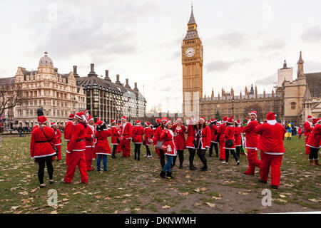 London, UK. 8th Dec 2013. Santa Clause Parade in Parliament Square, London, United Kingdom Credit:  galit seligmann/Alamy Live News Stock Photo