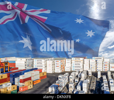 Fluttering Australian flag background for image of shipping containers stacked at a port for export or import. Composite image Stock Photo