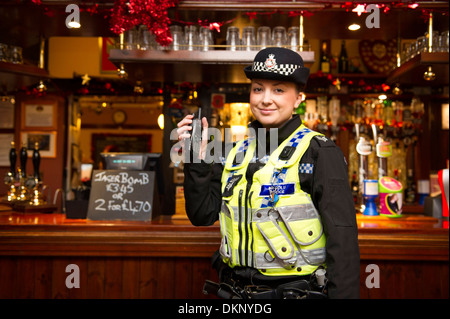 A police officer in a pub. Stock Photo