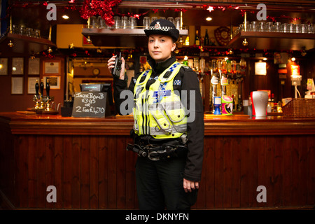A police officer in a pub. Stock Photo