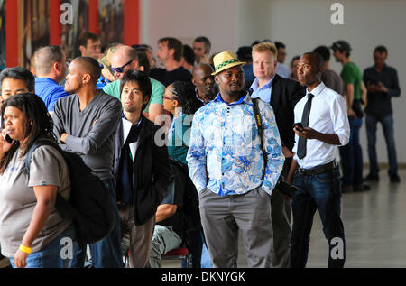 Johannesburg, South Africa. 8th Dec, 2013. Journalists who wish to cover the official State Funeral events of former South African president Nelson Mandela queue at the media accreditation center in Johannesburg, South Africa, Dec. 8, 2013. Credit:  Meng Chenguang/Xinhua/Alamy Live News Stock Photo