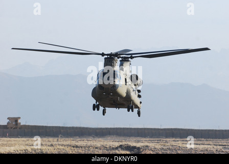 A CH-47F Chinook helicopter from B Company, 3rd Battalion (General Support), 10th Combat Aviation Brigade, Task Force Knighthawk, hovers while conducting a maintenance test flight Dec. 4, at Forward Operating Base shank, Afghanistan. Stock Photo