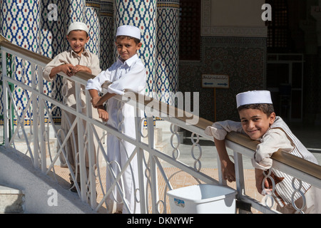 Libya, Zliten. Three Boys at the Mausoleum of Sidi Abdulsalaam al-Asmar. Stock Photo
