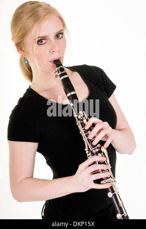 Attractive blond woman practicing her musical talent Stock Photo