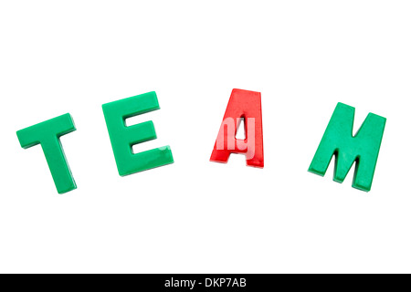 Colorful magnetic letters spelling out the word team on a white backdrop, perfect for business projects. Stock Photo