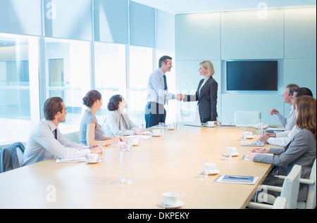 Business people shaking hands in meeting Stock Photo