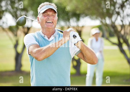 Senior couple on golf course Stock Photo