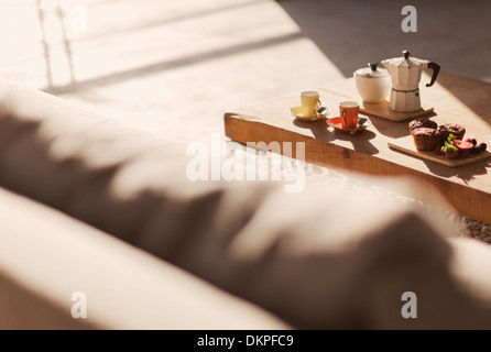 Breakfast on coffee table in living room Stock Photo