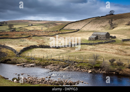 River and pastures in rural landscape Stock Photo