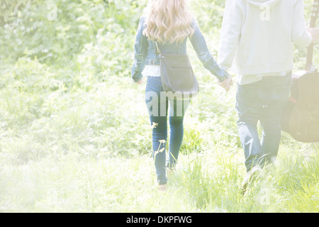 Couple holding hands in park Stock Photo