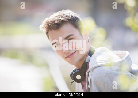 Man wearing headphones outdoors Stock Photo