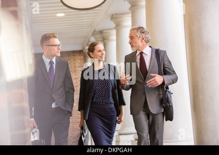 Business people talking in outdoor corridor Stock Photo
