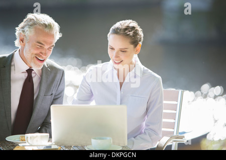 Business people working at sidewalk cafe Stock Photo