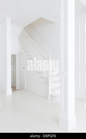 Staircase in white foyer Stock Photo