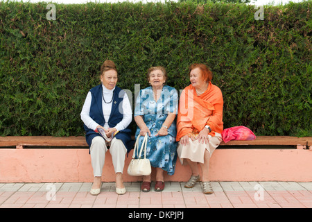 Three women sitting on a bench in Tiraspol, the capital of Transnistria. Stock Photo
