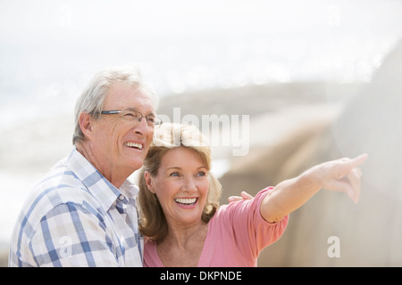 Older couple walking outdoors Stock Photo