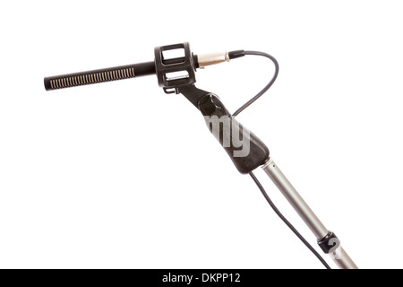 Close-up of a rifle microphone on a boom pole against a white background Stock Photo
