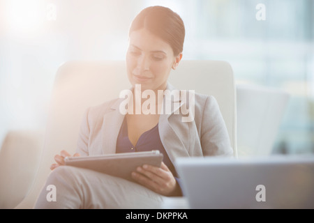 Businesswoman using digital tablet Stock Photo