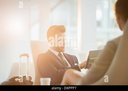 Business people working in airport Stock Photo