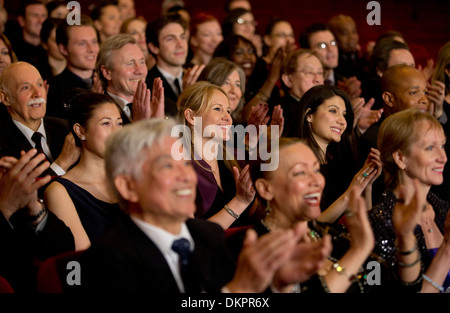 Clapping theater audience Stock Photo