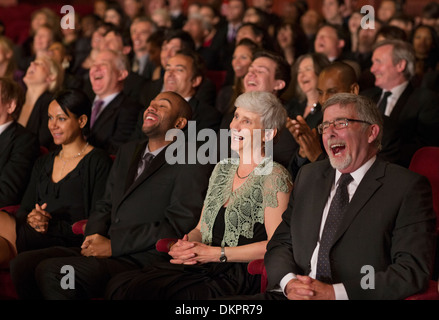 Laughing theater audience Stock Photo