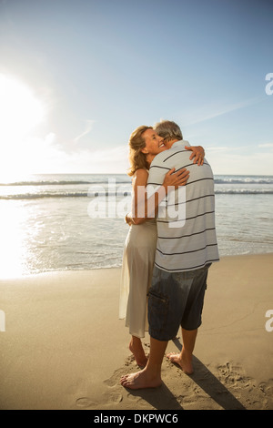 https://l450v.alamy.com/450v/dkpwc6/older-couple-hugging-on-beach-dkpwc6.jpg